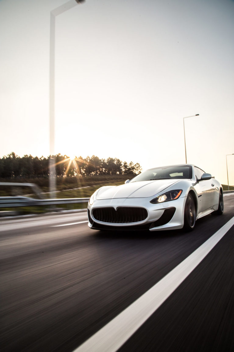sliver-metallic-color-sport-car-driving-with-high-speed-road