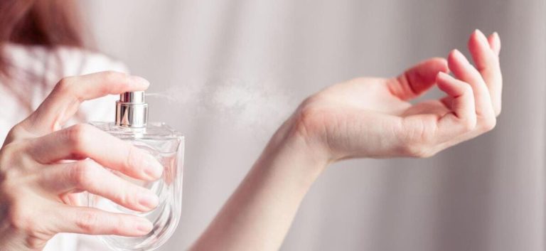 spraying-perfume-on-a-bare-skin