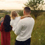 Cute family playing in a summer field